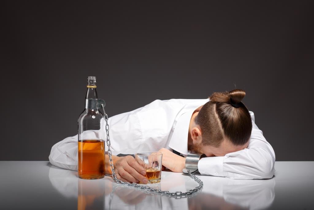 tired-young-businessman-drinking.jpg